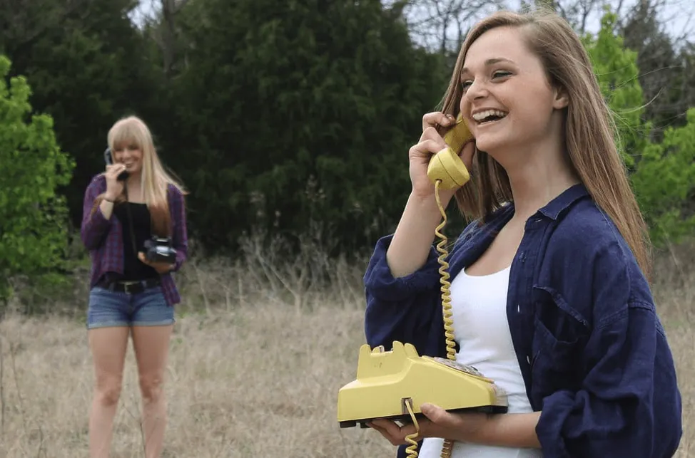 Two people having a phone conversation