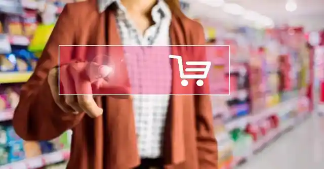 Woman in store pressing digital shopping cart button overlay
