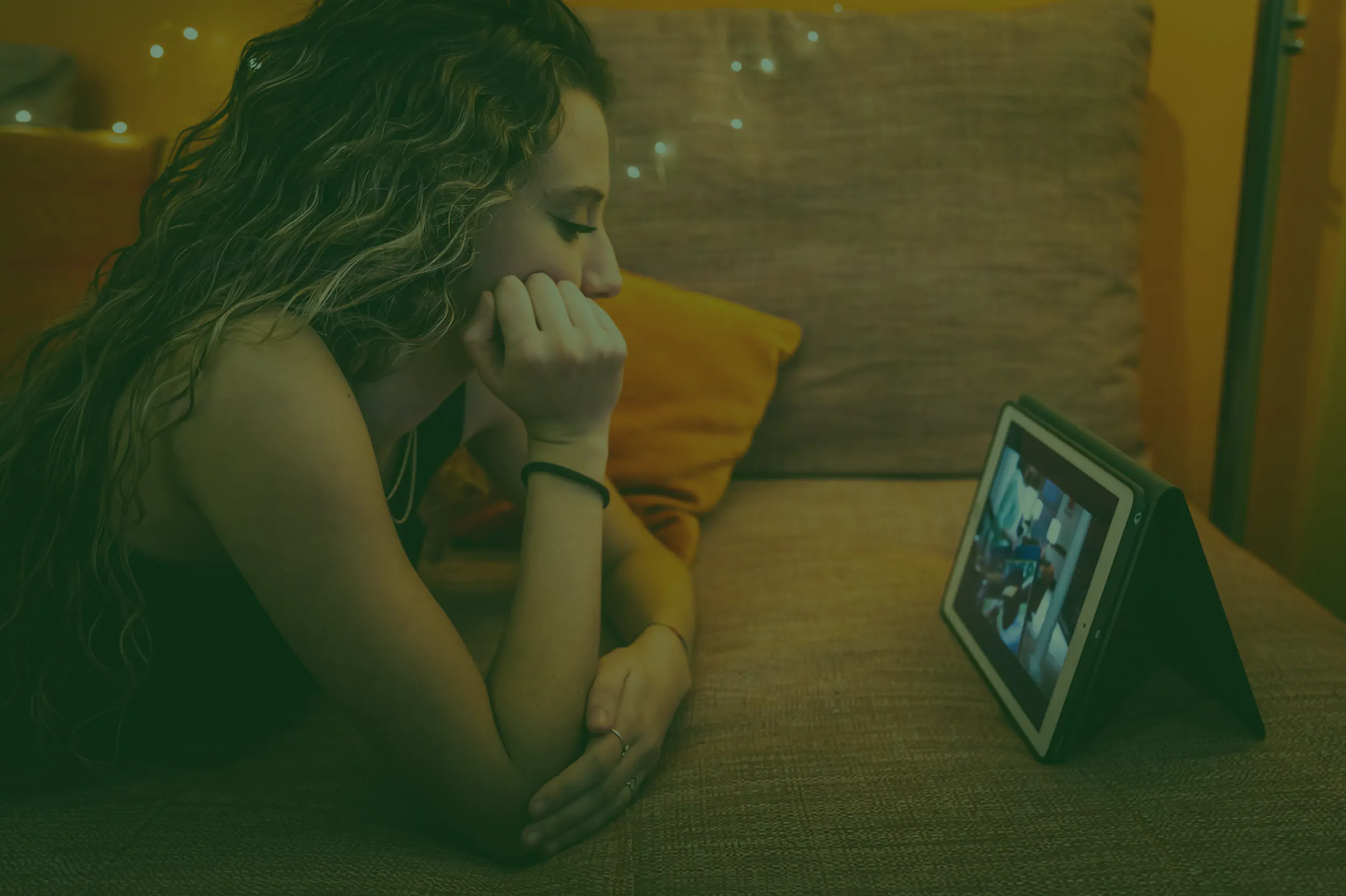 Women watching TV via tablet