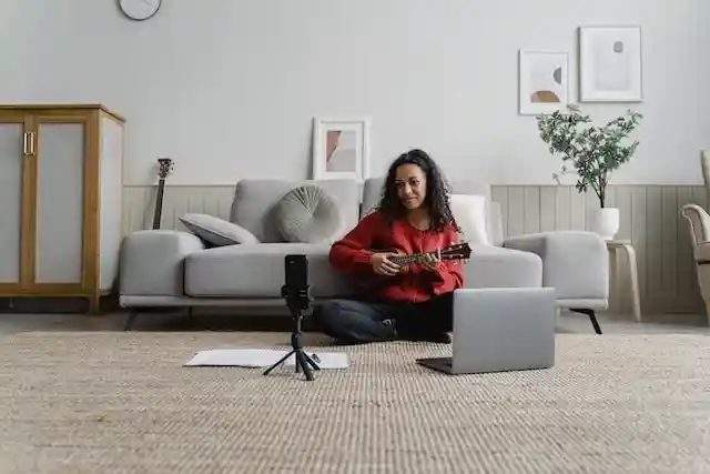 Woman recording herself playing an instrument for an Instagram Reel