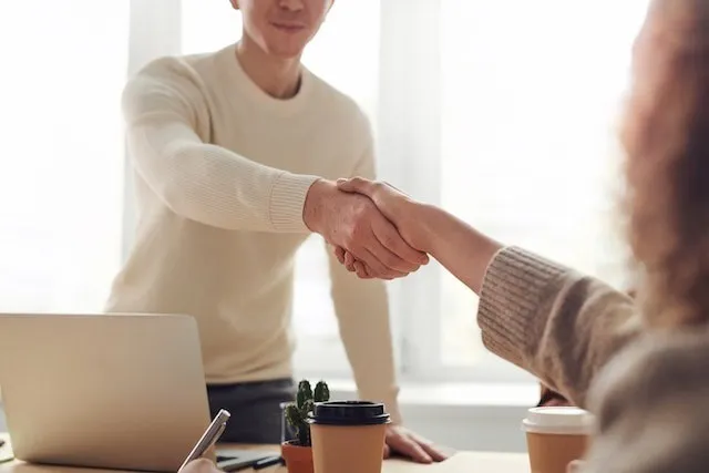 Business partners shaking hands 